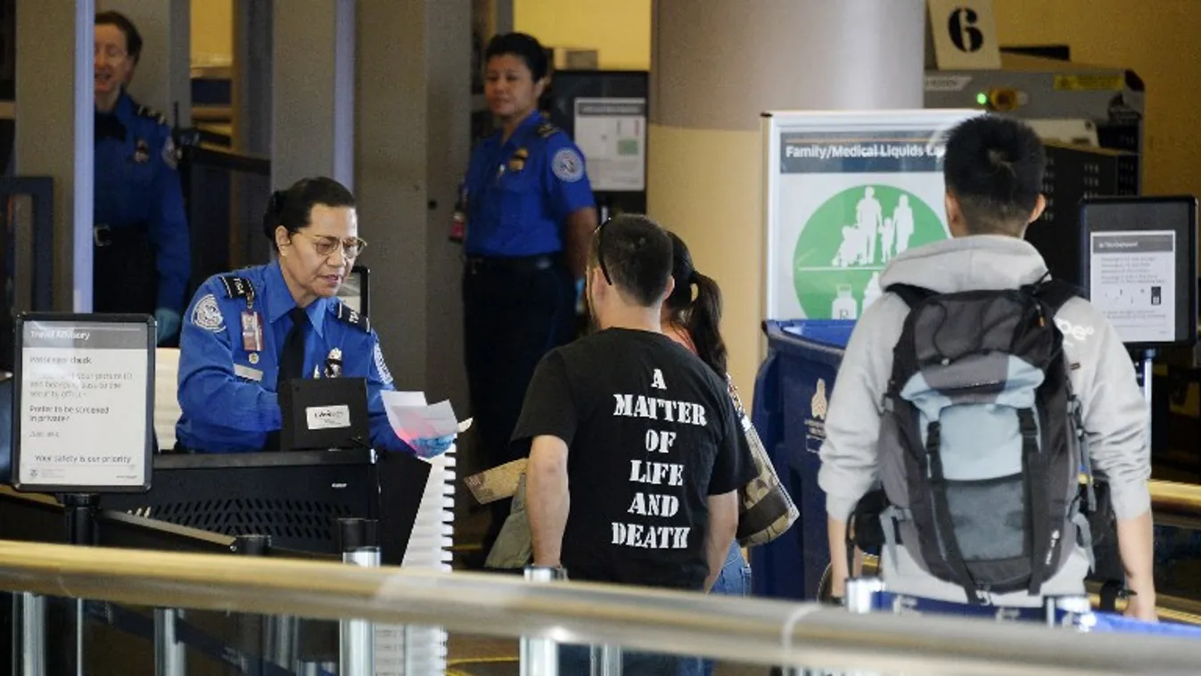 Travelers Use Los Angeles International Airport Day After Shooting Killed One TSA Agent GettyImageRank1 Passing Boarding Check Topics FINANCE Transportation HORIZONTAL Waist Up POLICE OFFICER USA AIRPORT Day California City Of Los Angeles Emergencies and 