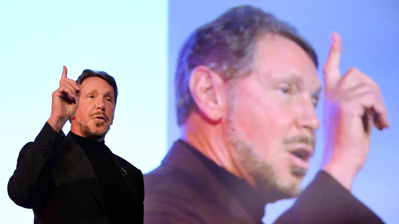 Larry Ellison, CEO of Oracle Corporation, gestures as he makes a speech during the New Economy Summit 2014 in Tokyo on April 9, 2014.  More than 1,000 business leaders, entrepreneurs, businessmen and students took part in the two-day forum.     AFP PHOTO/
