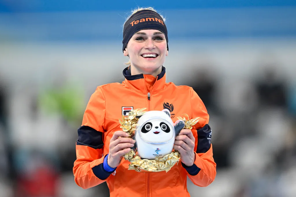 Gold medallist Netherlands' Irene Schouten celebrates during the venue ceremony for the women's speed skating 5000m event during the Beijing 2022 Winter Olympic Games at the National Speed Skating Oval in Beijing on February 10, 2022. (Photo by WANG Zhao 
