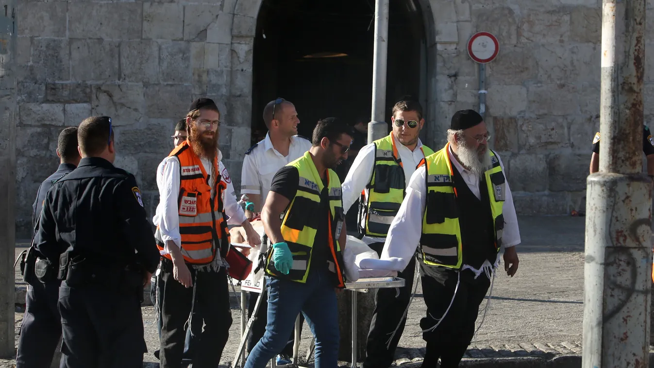 Horizontal Israeli medics carry an injured man following a Palestinian stabbing attack near the Herod's Gate entrance to the Old City of Jerusalem, on September 19, 2016.
A Palestinian stabbed and wounded two Israeli police officers in east Jerusalem near