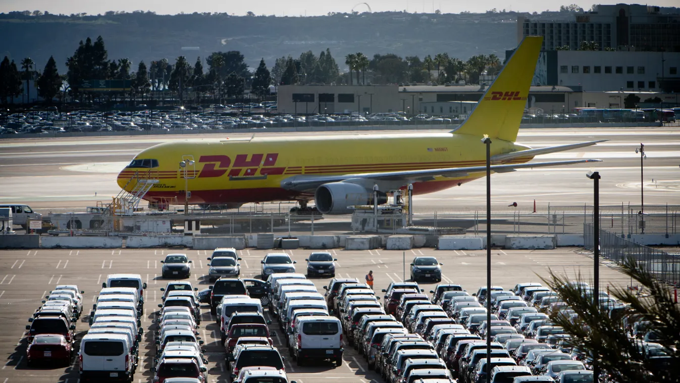 DHL freighter at Lindbergh Field CAR takeoff parking lot liftoff heaven automobile dealing BOEING AIRPORT USA TRAFFIC SKY circulation BLUE COLOUR CAST TRANSPORT cars lift off United States of America auto take off FIN 
