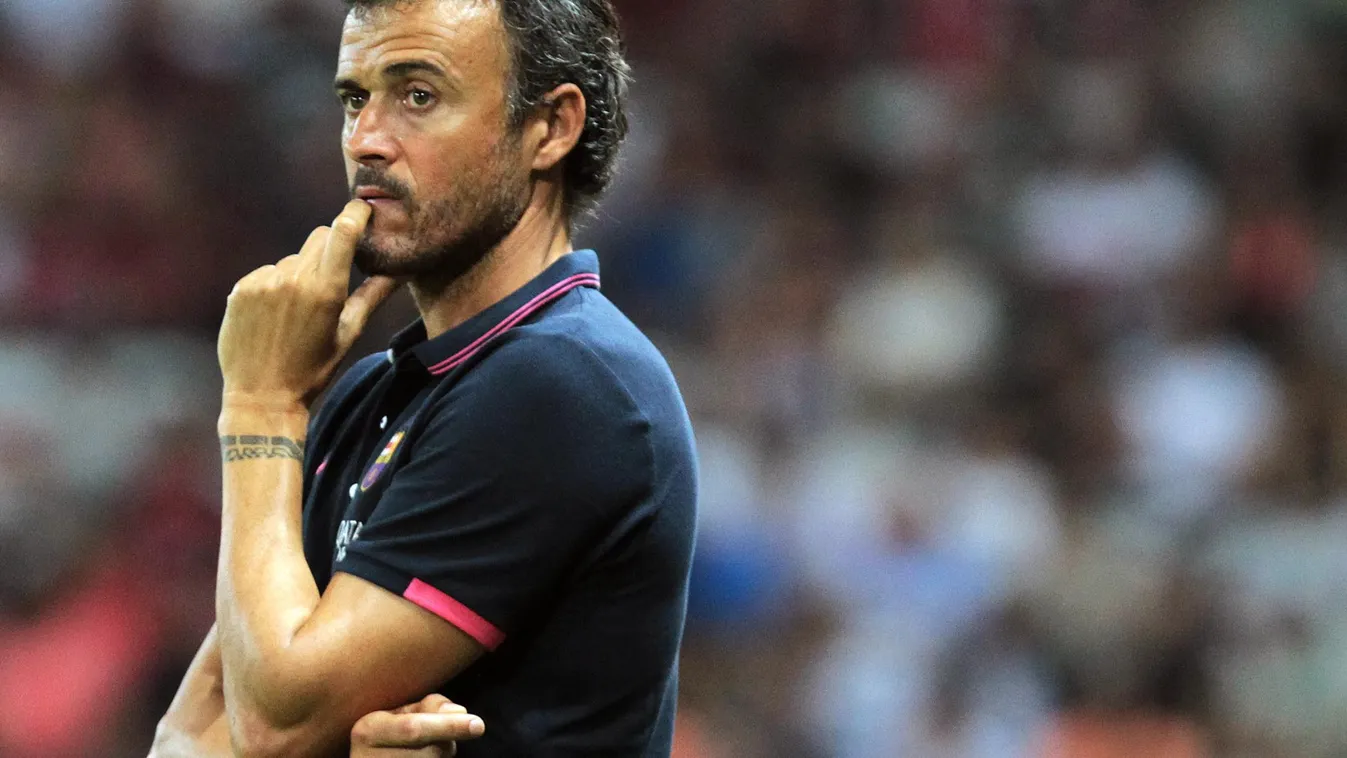 Barcelona's Spanish head coach Luis Enrique looks on during a friendly football match Nice (OGCN) vs Barcelona (FCB) on August 2, 2014 at the Allianz Riviera stadium, in Nice, southeastern France. AFP PHOTO / JEAN CHRISTOPHE MAGNENET 