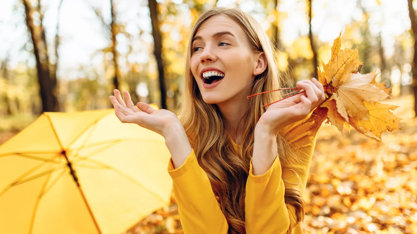 young girl in autumn Park sitting on a blanket, enjoying the warm Sunny weather autumn outdoor Park girl female lifestyle nature season beautiful smile yellow happy seasonal woman fashion posing adult October lady man background stylish cheerful pretty jo