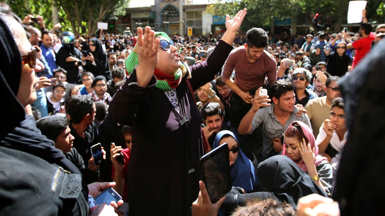 Iranians take part in a protest in front of the judiciary building on October 22, 2014 in Isfahan, 450 kilometres south of Tehran, in solidarity with women injured in a series of acid attacks. Around 1,000 people took part in the protest calling for bette