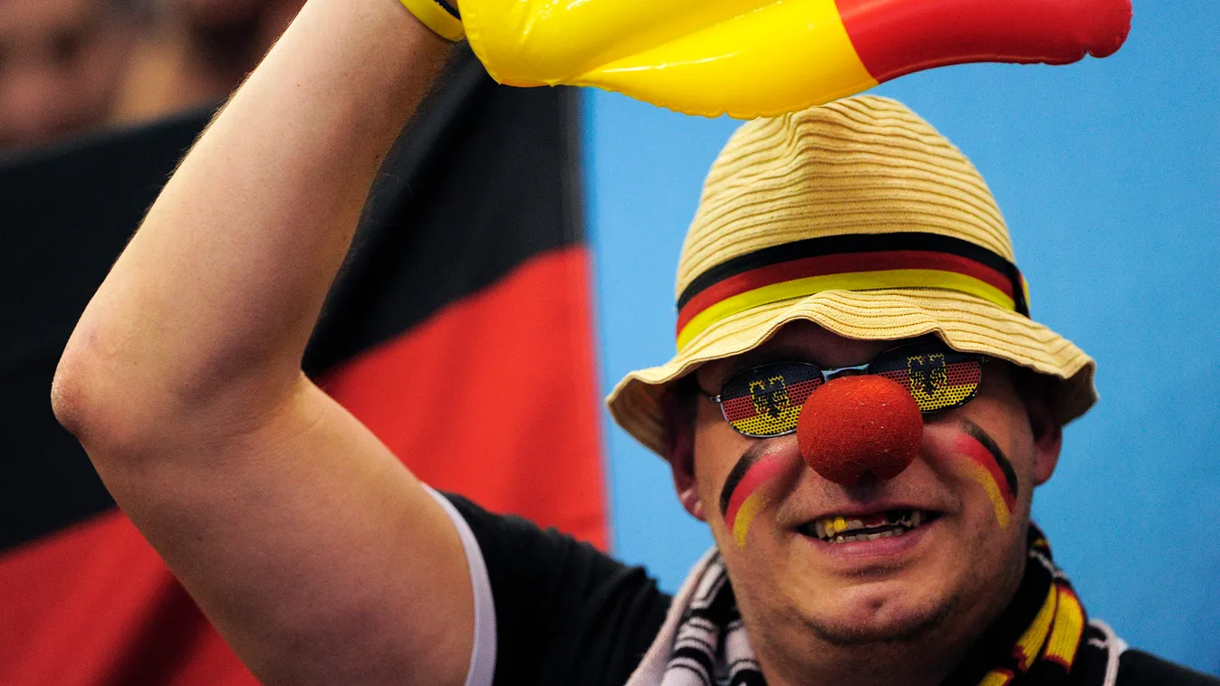 A German supporter cheers his team during the 23rd Men's Handball World Championships preliminary round Group A match Germany  vs Montenegro at the Palacio de los Deportes de Granollers on January 16, 2013.   AFP PHOTO/ JOSEP LAGO 
