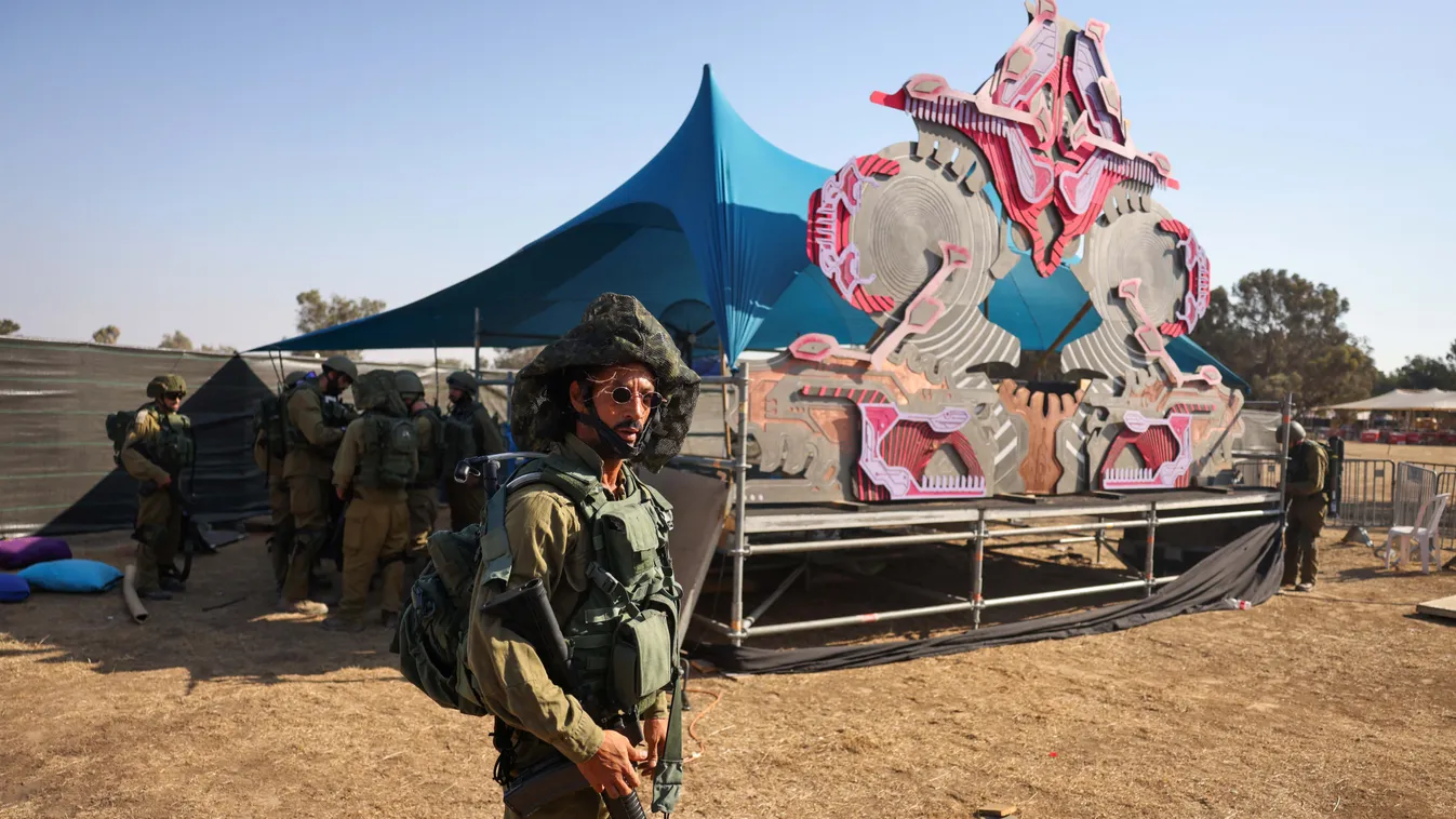 conflict Horizontal Israeli soldiers search the site of the weekend attack by Palestinian militants on the Supernova Desert Music Festival, near kibbutz Reim in the Negev desert in southern Israel on October 12, 2023. Thousands of people, both Israeli and