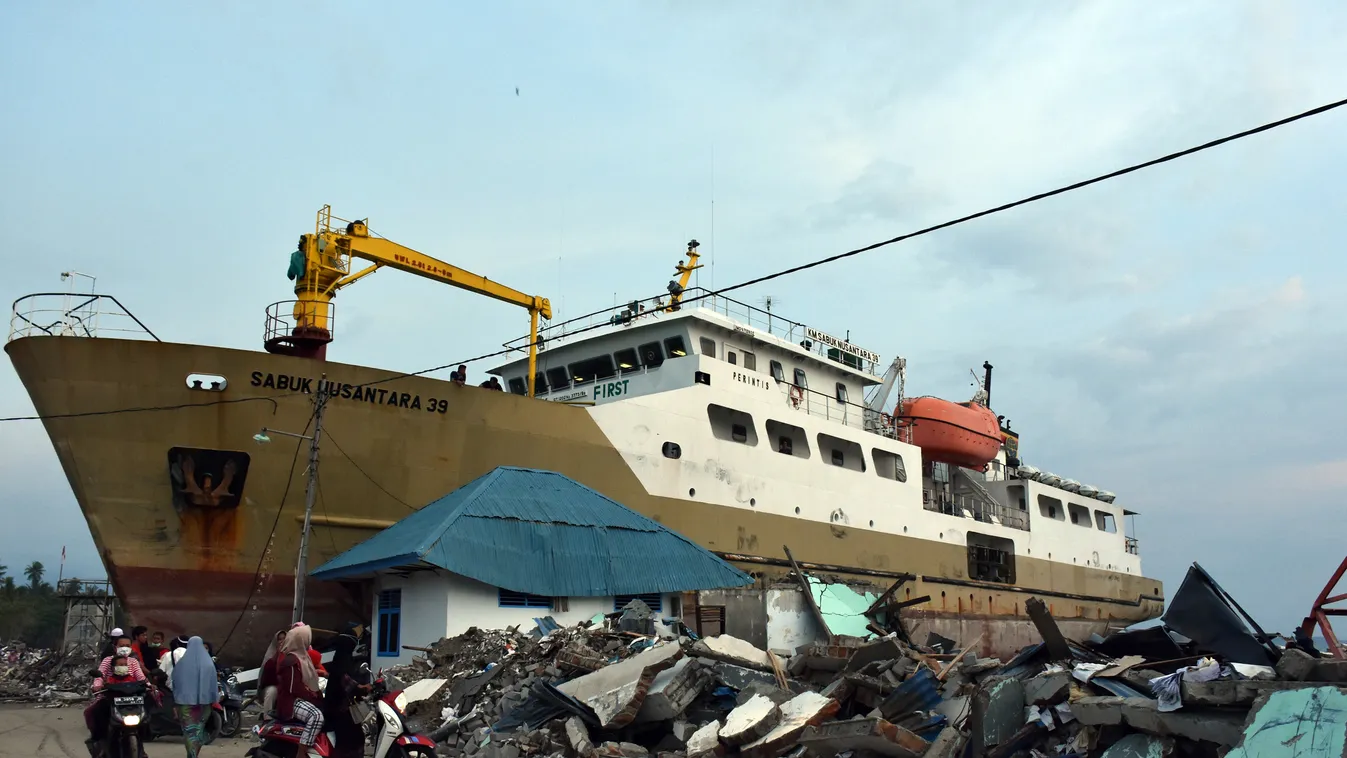 Aftermath of earthquake and tsunami waves in Indonesia EARTHQUAKE Indonesia Disaster TIDAL WAVE vessel stranded photography Palu Strand Central Sulawesi PALU, INDONESIA - OCTOBER 16: A passenger ship is stranded on the land after the 7.4 magnitude earthqu
