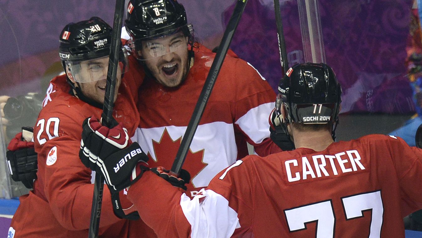 461426963 Canada's Drew Doughty (C) celebrates with teammates after scoring in overtime during the Men's Ice Hockey Group B match Finland vs Canada at the Bolshoy Ice Dome during the Sochi Winter Olympics on February 16, 2014 in Sochi.   AFP PHOTO / ALEXA