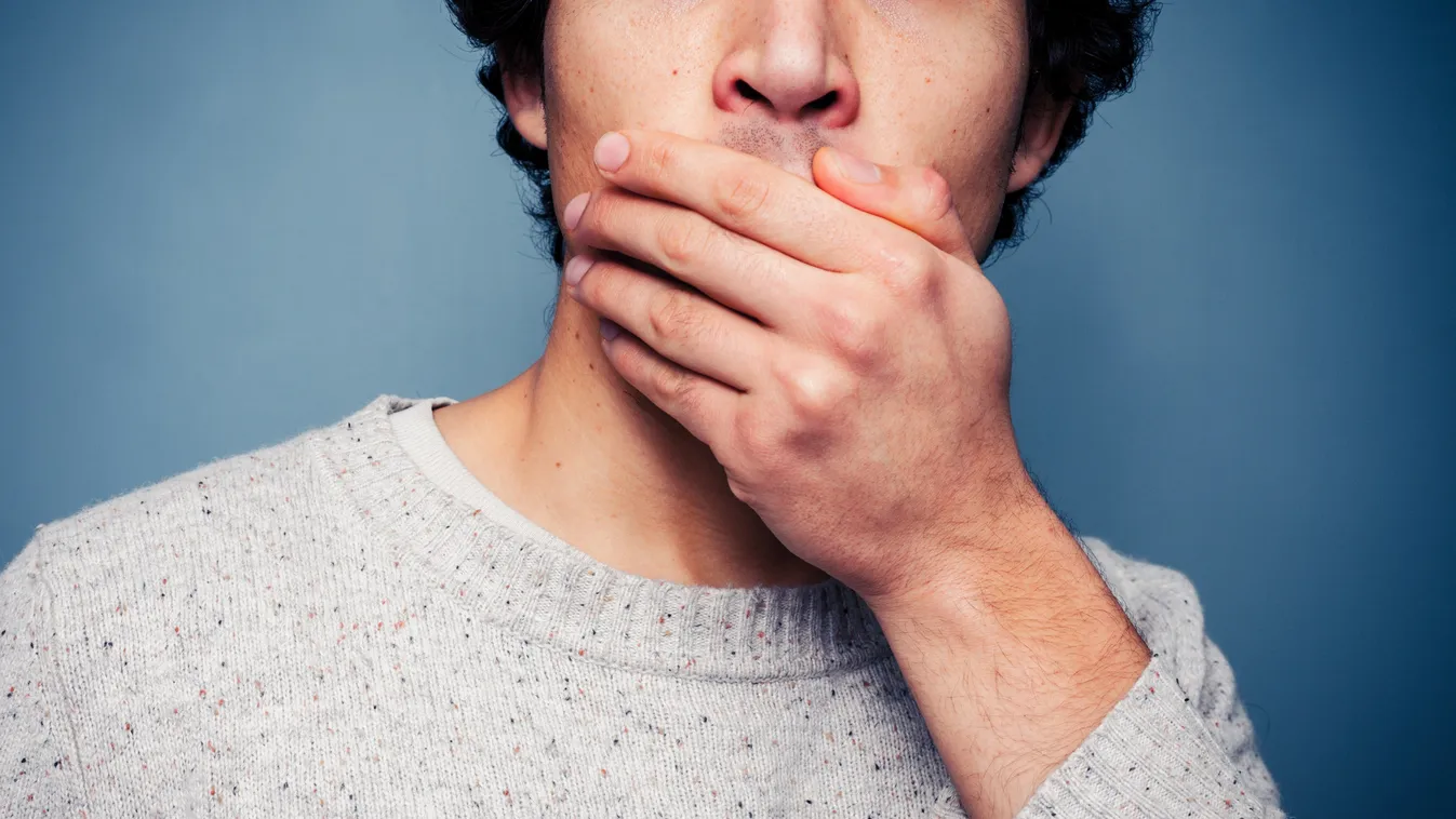 Shocked young man covering his mouth Adult Asian Ethnicity Asian and Indian Ethnicities Awe Backgrounds Bad News Behavior Casual Close-up Covering Despair Expressing Negativity Facial Expression Facial Mask Fear Human Face Human Hand Human Mouth Male Men 