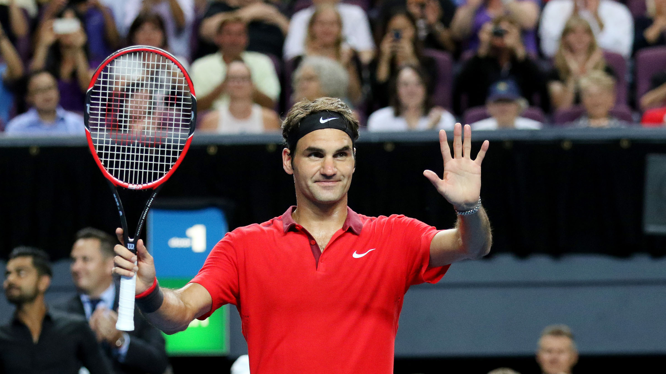 Roger Federer of Switzerland celebrates his win against Lleyton Hewitt of Australia during their Fast4 tennis exhibition match in Sydney on January 12, 2015. AFP PHOTO / Nikki SHORT 