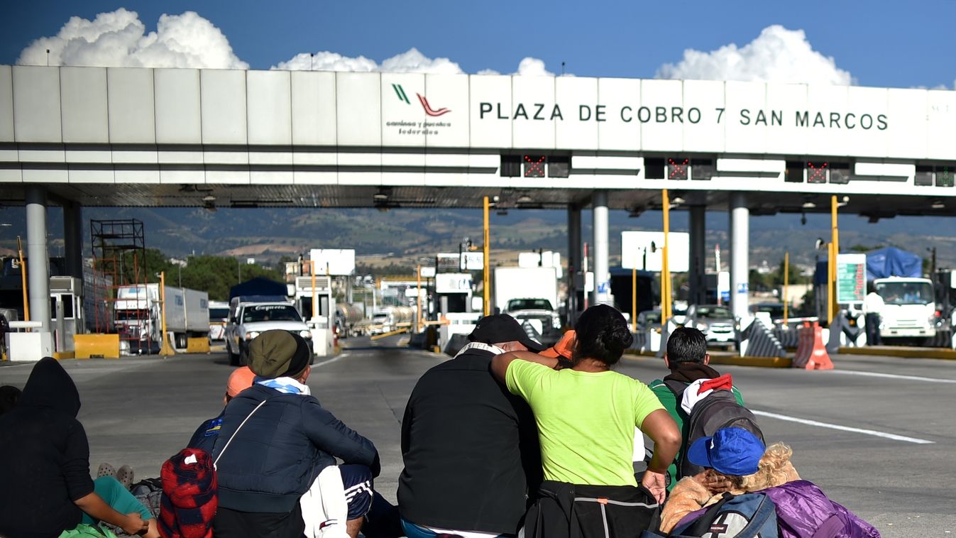 Horizontal MIGRATION AND IMMIGRATION Migrants from poor Central American countries -mostly Hondurans- moving towards the United States in hopes of a better life or to escape violence wait for a ride at the toll in San Marcos, on the Mexico City-Puebla hig