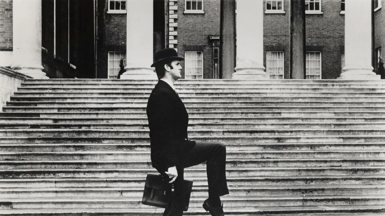Monty Python's Flying Circus black humor satire comedy publicity still production still british english 1970s seventies briefcase silly walk Horizontal TELEVISION MAN HAT 