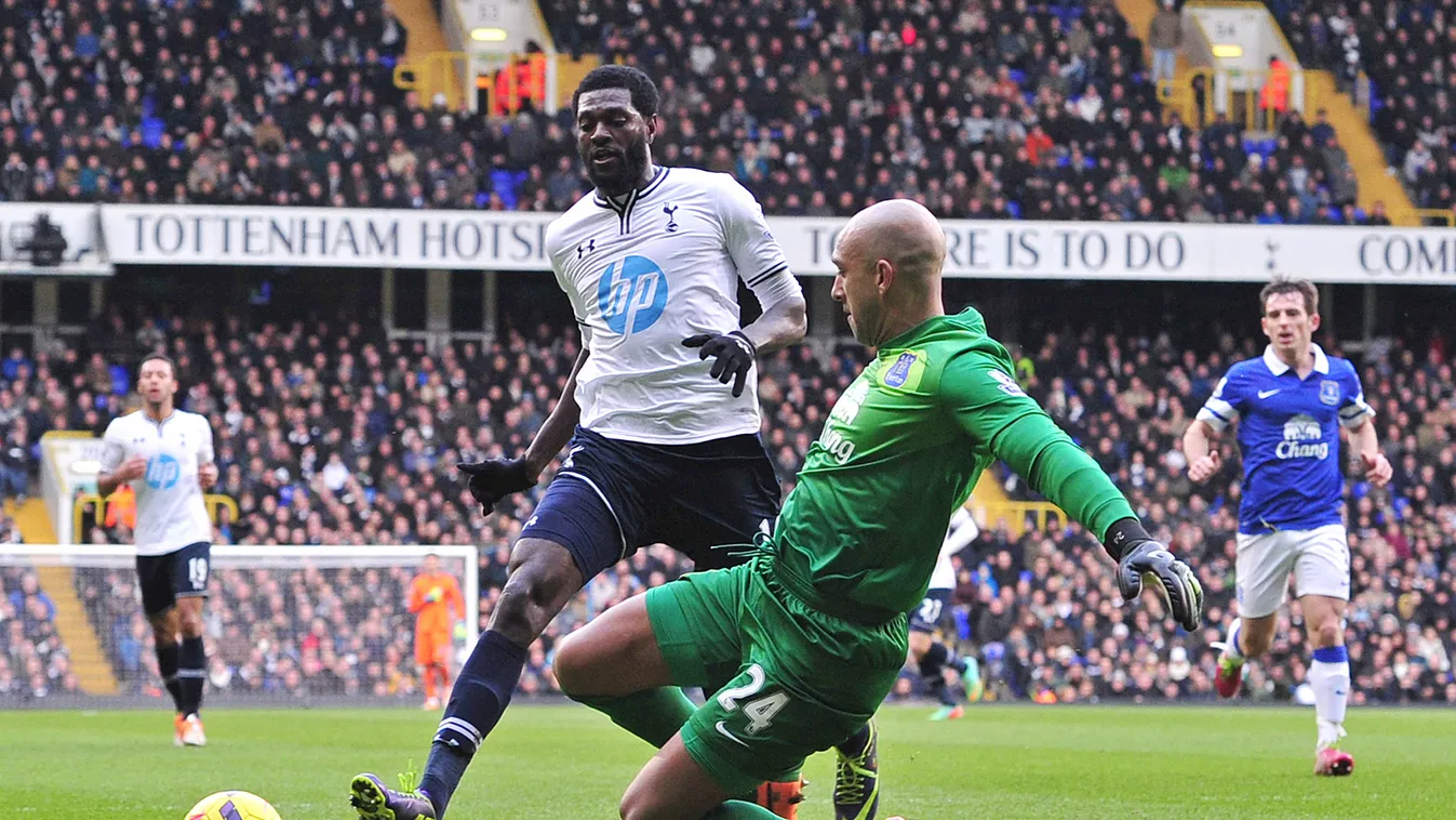 170627051 Tottenham Hotspur's Togolese striker Emmanuel Adebayor (2nd L) challenges Everton's US goalkeeper Tim Howard during an English Premier League football match between Tottenham Hotspur and Everton at White Hart Lane in London, on February 9, 2014.