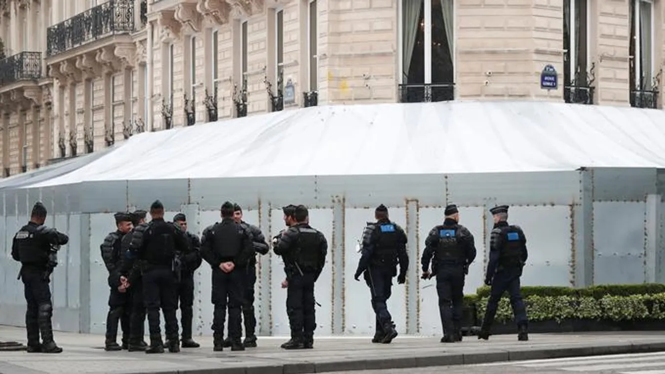 French gendarmes and riot police officers secure the Champs-Elysees avenue in front of the famed restaurant Fouquet's during the Act XIX (the 19th consecutive national protest on a Saturday) of the "yellow vests" movement in Paris 