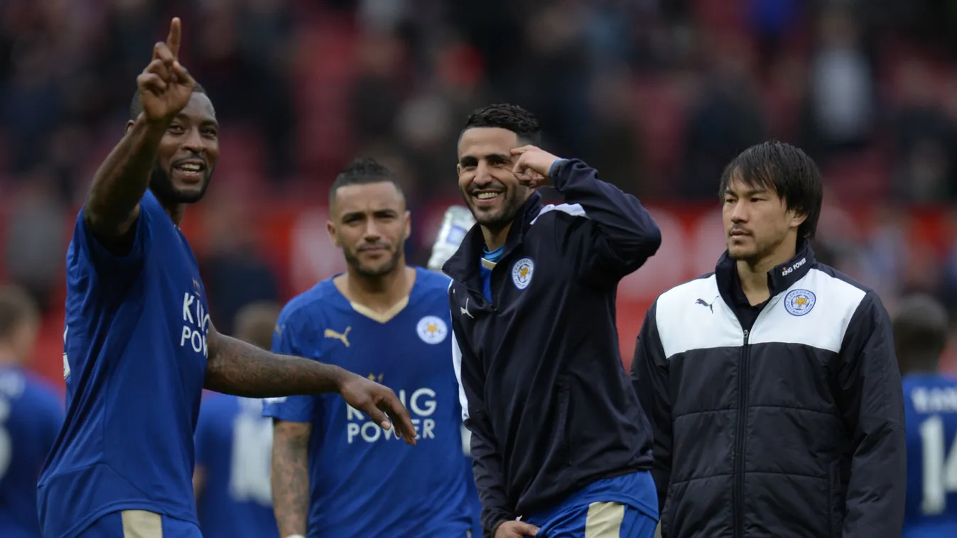 Leicester City's English defender Wes Morgan (L) and Leicester City's Algerian midfielder Riyad Mahrez (C) gesture after the English Premier League football match between Manchester United and Leicester City at Old Trafford in Manchester 