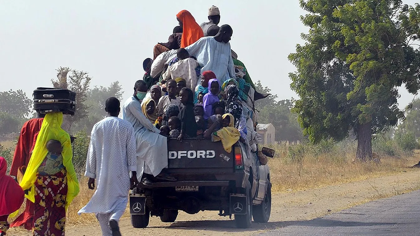 Horizontal A loaded truck wait to carry people fleeing from Boko Haram Islamists at Mairi village outskirts of Maiduguri capital of northeast Borno State, on February 6, 2016.
Suspected Boko Haram Islamists have killed four people following raids on villa