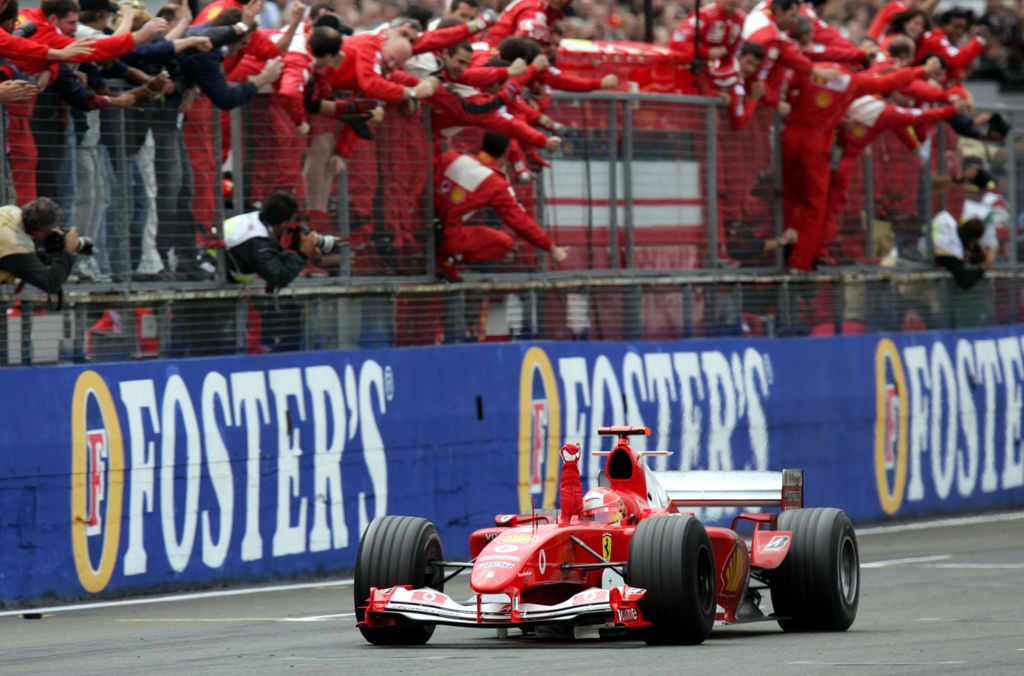 Formula 1 - Michael Schumacher wins in Silverstone Motor_Racing SPO Sports cheering ferrari formula_one GENERAL VIEW group WAVING HORIZONTAL 