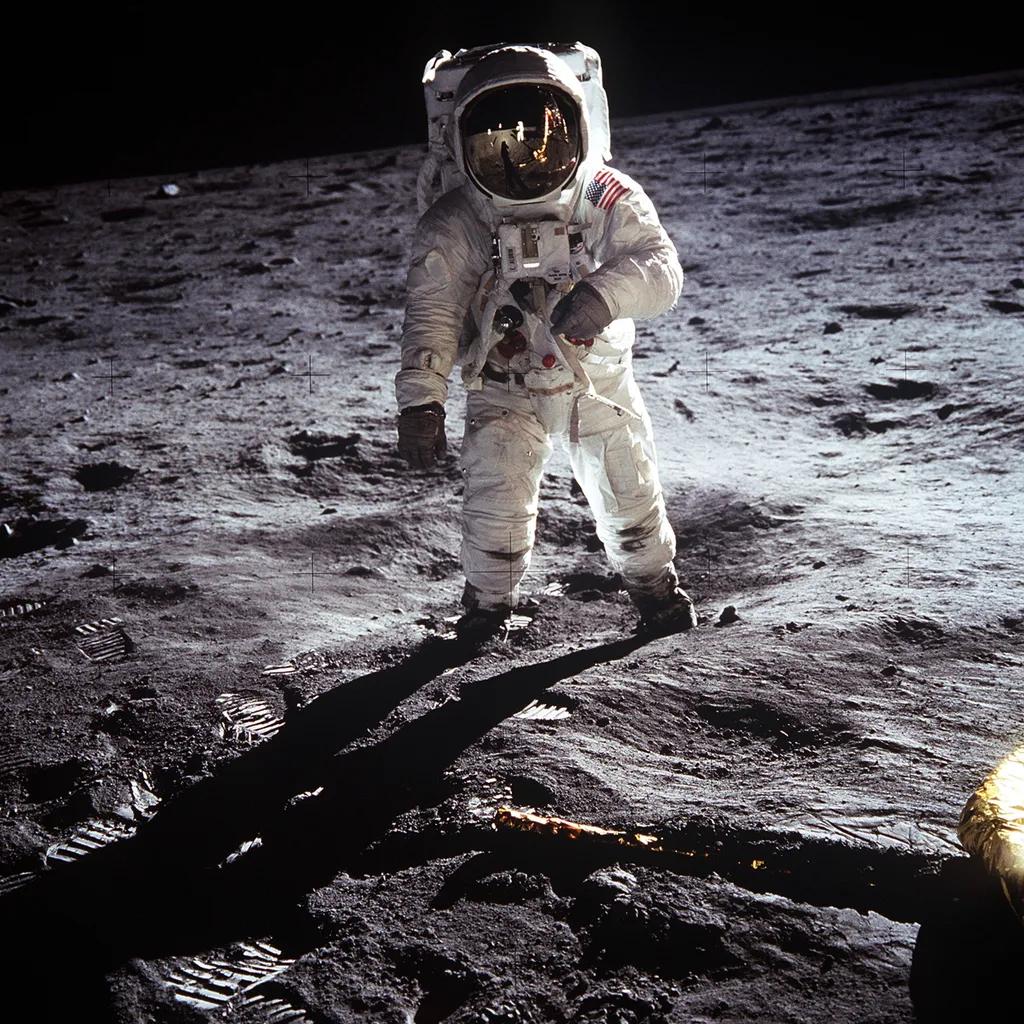 Apollo 11 Buzz Aldrin Astronaut Buzz Aldrin, lunar module pilot, walks on the surface of the Moon near the leg of the Lunar Module (LM) "Eagle" during the Apollo 11 exravehicular activity (EVA). Astronaut Neil A. Armstrong, commander, took this photograph