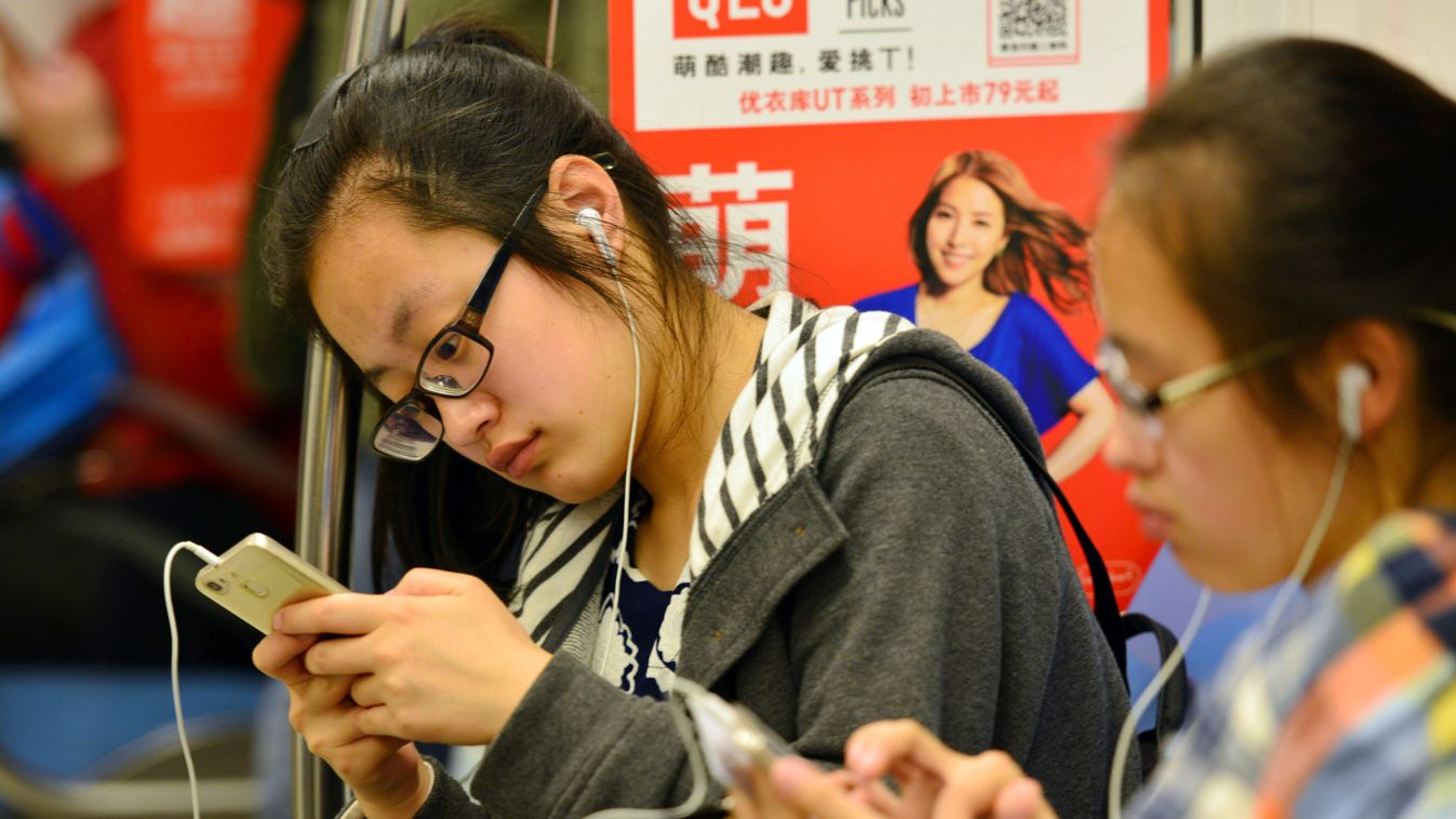 China Chinese Internet netizen cyber --FILE--Chinese passengers use messaging app WeChat of Tencent on their smartphones on a metro train in Nanjing city, east China's Jiangsu province, 22 April 2016.

China, with 700 million mobile Internet users, has 