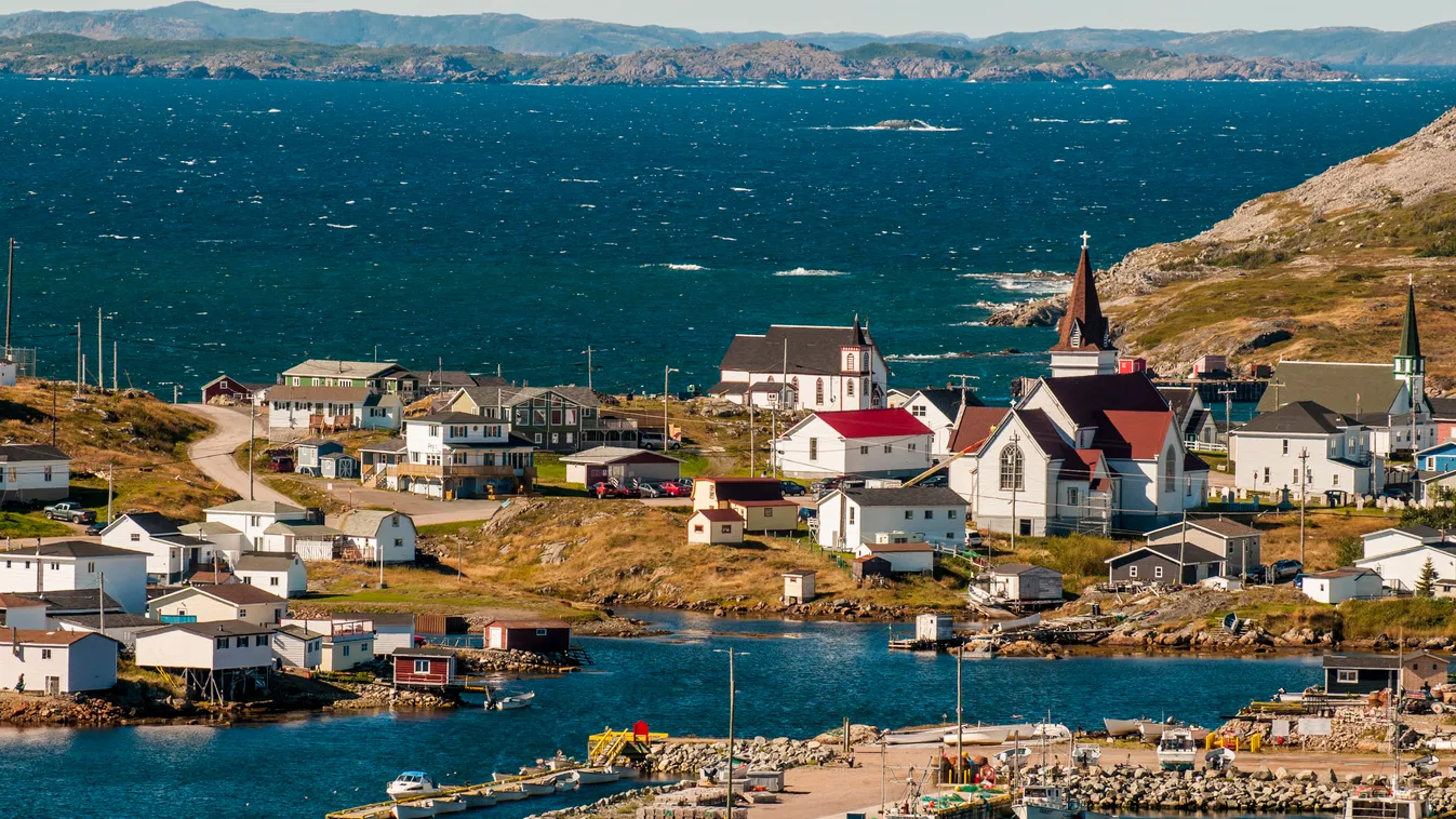 Fogo Island, Fogo Island, Newfoundland, Canada. Photography Color Image Travel Destinations Travel Incidental People Outdoors Day Canada Tilting Village Harbor Waterfront Fogo Island Newfoundland Coastline Water's Edge Waterfronts Seaboard Seafront Se 