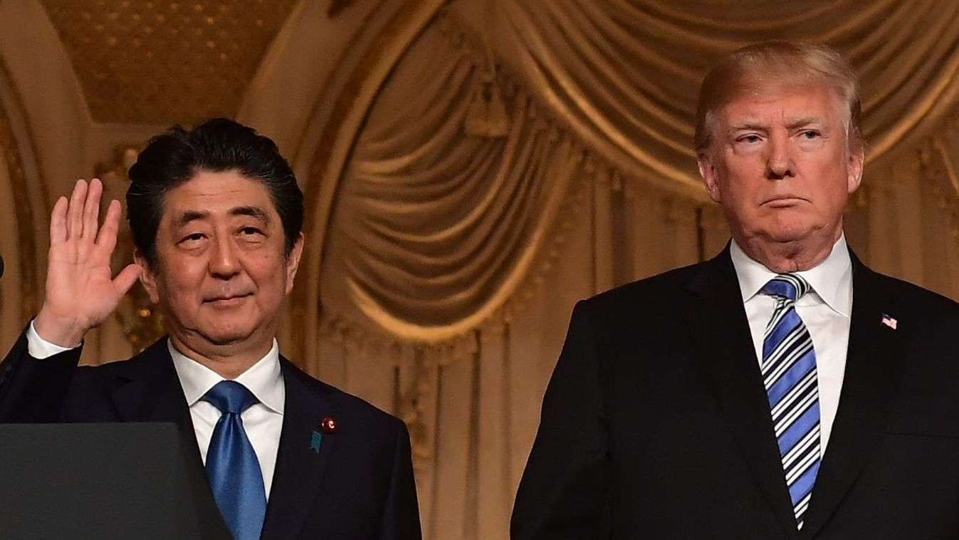 US JAPAN SUMMIT TRUMP ABE politics Horizontal Japan's Prime Minister Shinzo Abe stands with US President Donald Trump at the end of a joint press conference at Trump's Mar-a-Lago estate in Palm Beach, Florida on April 18, 2018. / AFP PHOTO / MANDEL NGAN 