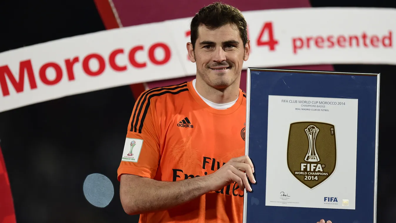 Real Madrid's goalkeeper Iker Casillas poses with a trophy at the end of the FIFA Club World Cup final football match against San Lorenzo at the Marrakesh stadium in the Moroccan city of Marrakesh on December 20, 2014. Real Madrid defeated San Lorenzo of 
