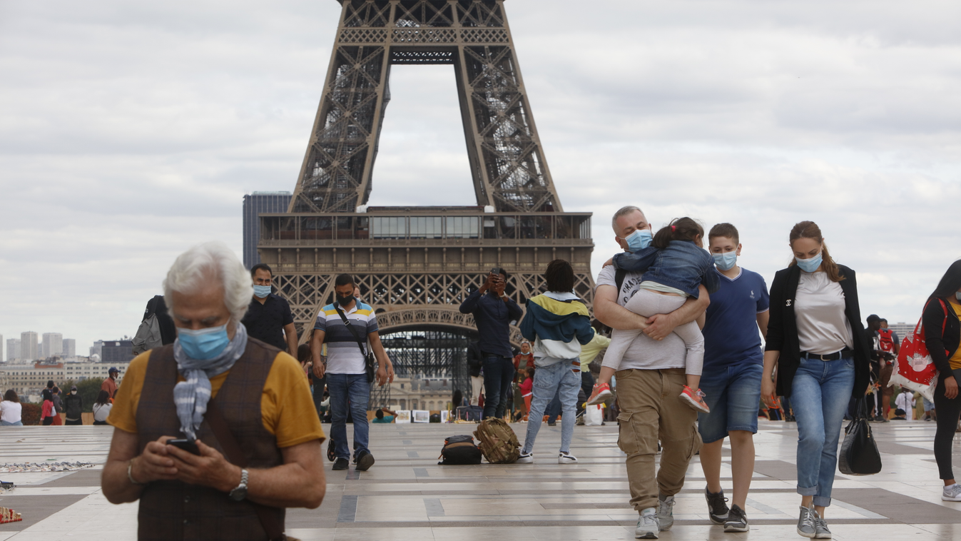 Coronavirus In Paris Coronavirus In Paris TOURIST TOURISM EIFFEL TOWER people ECONOMY france MEDICINE AND HEALTH PROTECTIVE MASK Mehdi Taamallah NurPhoto Paris Tourists person clothing SKY footwear MAN outdoor ground JEANS BUILDING Medium Group Of People 