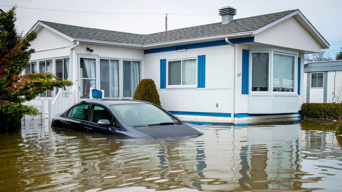flood TOPSHOTS Horizontal An automobile is submerged in flood waters in the Montreal suburb of Sainte-Marthe-sur-le-Lac, Quebec, Canada, April 29, 2019. - More than 10,000 people have been evacuated from their homes in eastern Canada in recent days as spr