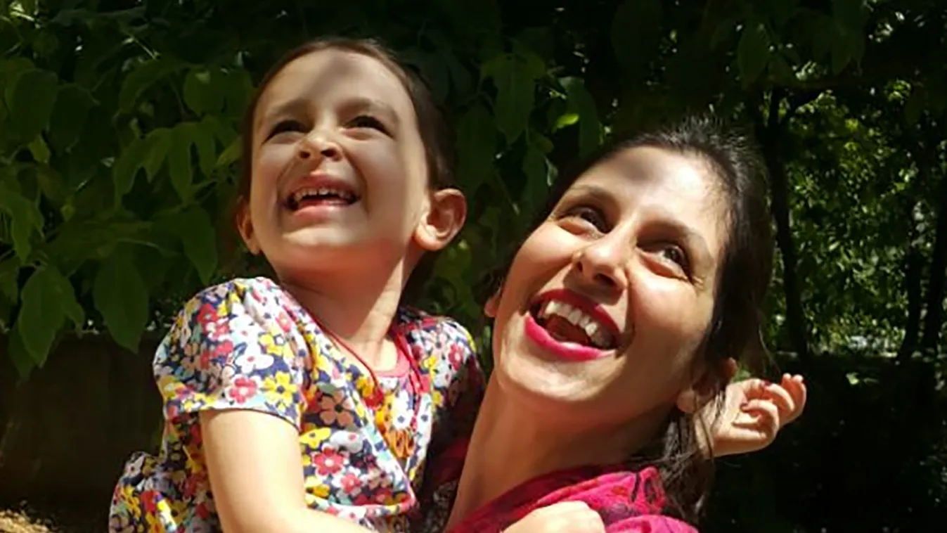 Horizontal MIDDLE EAST PRISONER WOMAN MOTHER JOY SMILING PRISON RELEASE RELEASE 