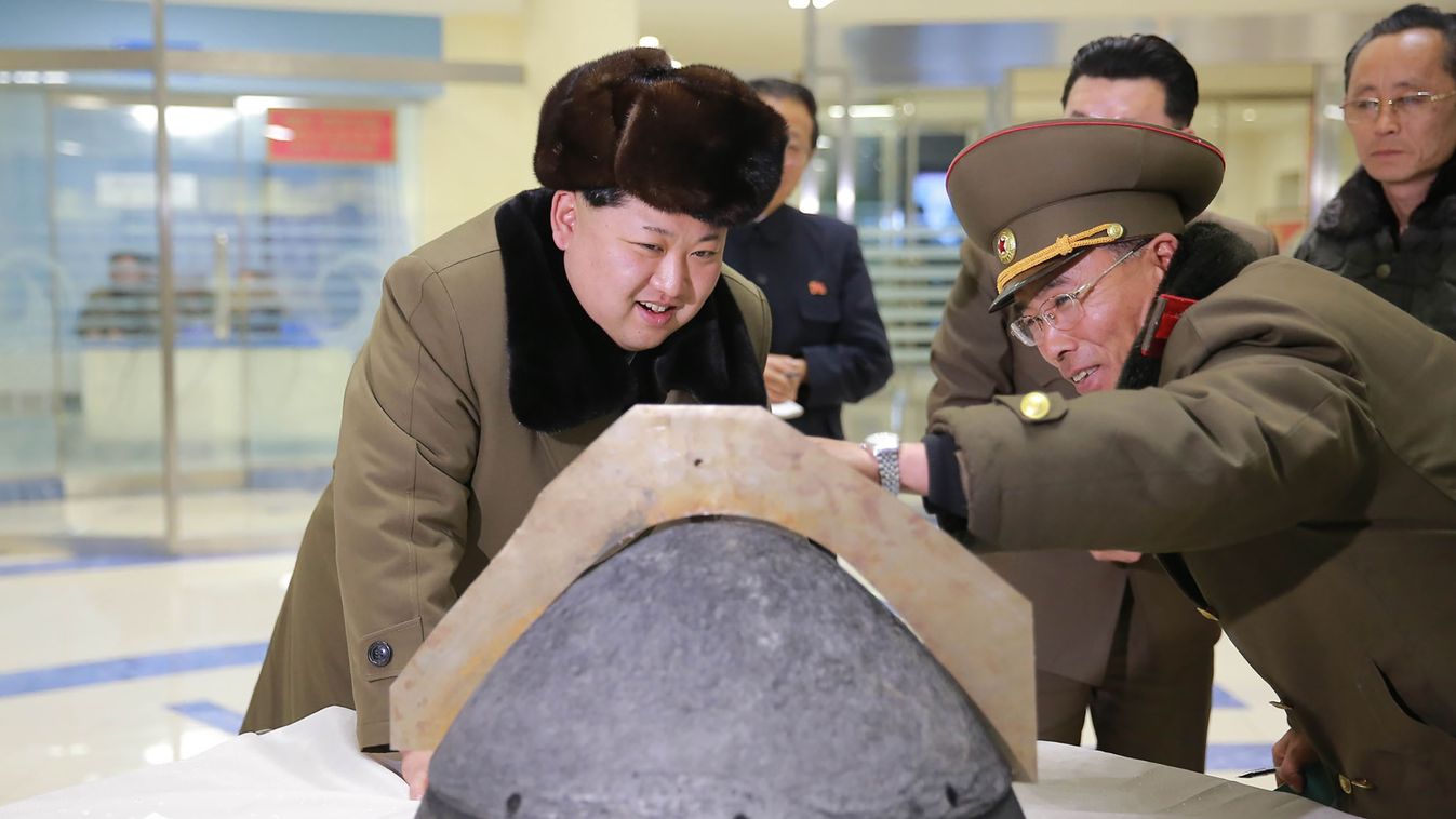 defence Horizontal This undated picture released from North Korea's official Korean Central News Agency (KCNA) on March 15, 2016 shows North Korean leader Kim Jong-Un (L) being briefed during an atmospheric re-entry environment simulation of a locally man
