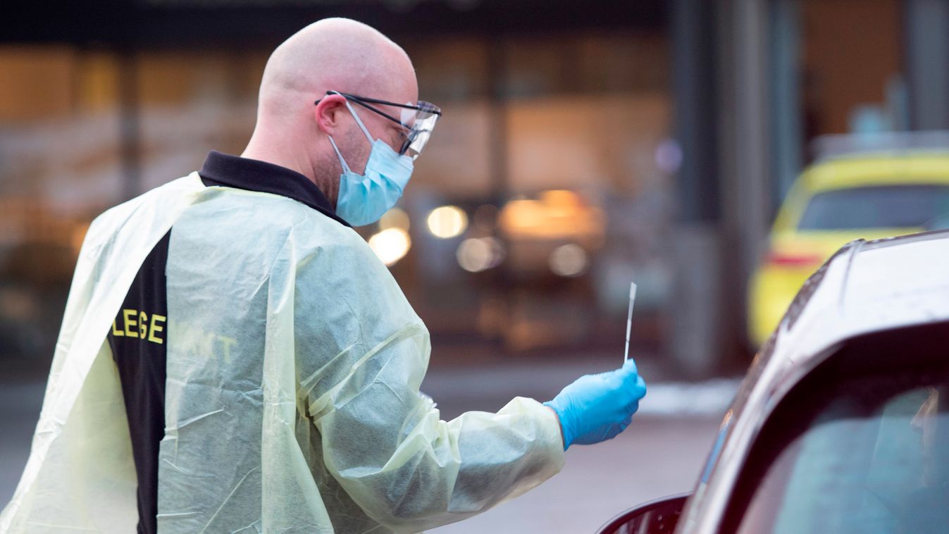 health epidemic Horizontal Chief doctor Germra Schneider at the emergency department in municipality Asker and Baerum tests a person for the novel coronavirus in a car outside the emergency unit on March 2, 2020 in Sandvika, Norway. - Medical staff handle