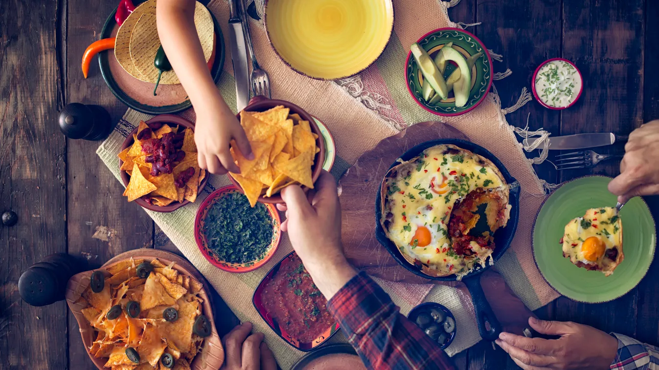 Eating Mexican Eggs and Tortilla Chips with Salsa and Jalapenos Nachos Meal Vegetarian Food Gourmet Homemade Dip Tortilla Chip Salsa Jalapeno Pepper Huevos Rancheros Guacamole Corn Appetizer Baked Avocado Tortilla - Flatbread Savory Sauce Chili Pepper Mex