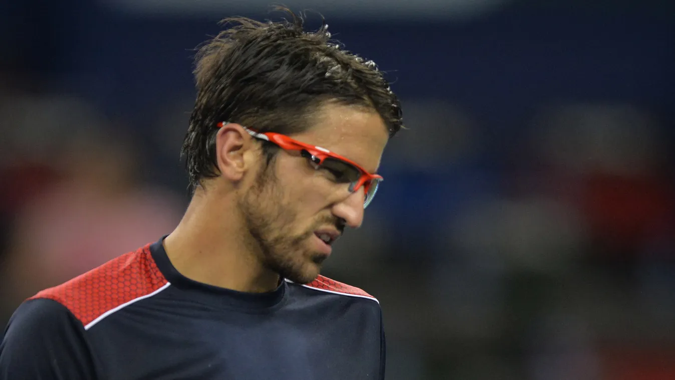 HORIZONTAL TENNIS PORTRAIT PROFILE GLASSES Janko Tipsarevic of Serbia pulls a face during his first round match against  Marcel Granollers of Spain in the Shanghai Masters tennis tournament in Shanghai on October 7, 2013. Granollers won the match 6-4, 6-4