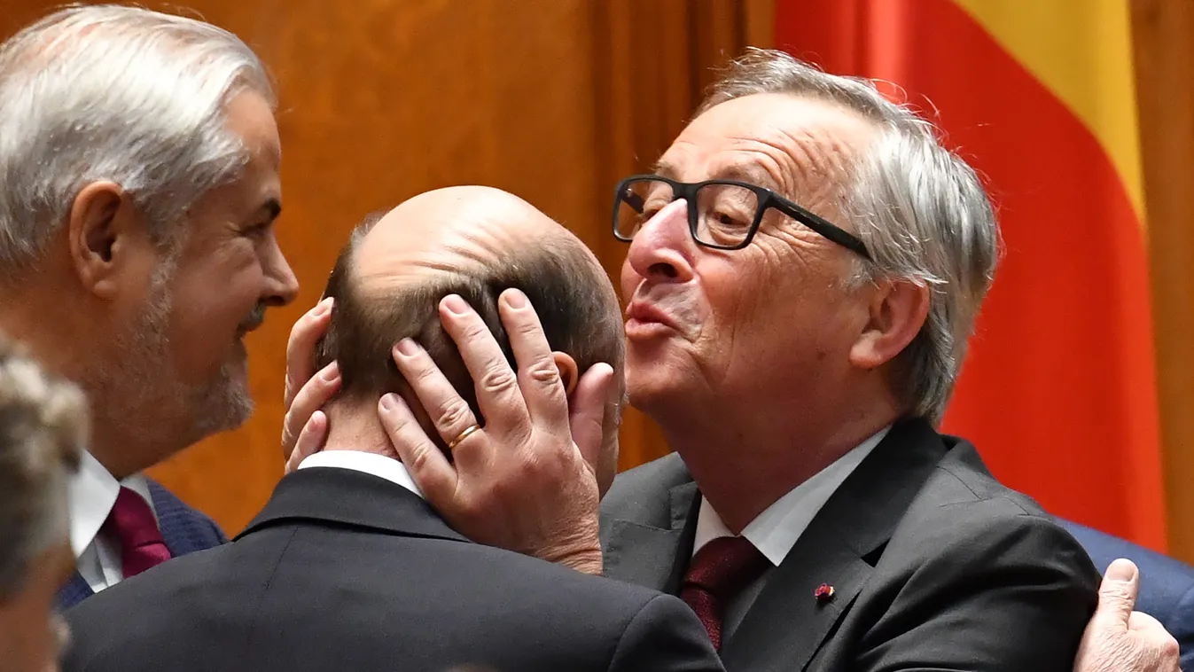 Horizontal President of the European Commission Jean Claude Juncker (R) kisses former President of Romania Traian Basescu (C) on the forhead, as he arrives at the Romanian Parliament in Bucharest May 11, 2017.
Jean-Claude Juncker visits Romania which was 