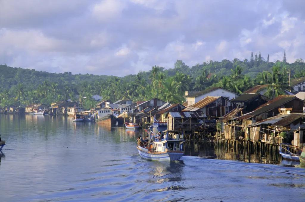 Fishing trawlers in the harbour, Phu Quoc Island, southwest Vietnam, Indochina, Southeast Asia, Asia ARCHITECTURE ASIA BOAT BUILDING CLOUD color image contemporary day FISHING FISHING BOAT harbor harbour HORIZONTAL HOUSE Indochina ISLAND LANDSCAPE MOUNTAI