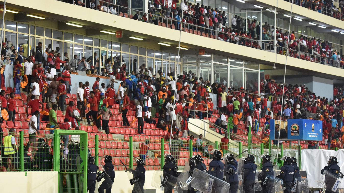 528433927 Policemen evacuate a tribune during the 2015 African Cup of Nations semi-final football match between Equatorial Guinea and Ghana in Malabo, on February 5, 2015. Play was halted eight minutes from time in the Africa Cup of Nations semi-final bet