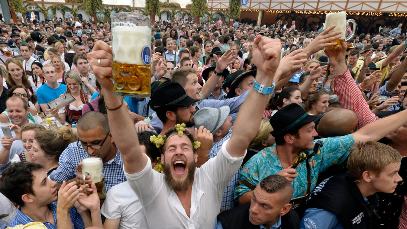 - Visitors celebrate with first beer mugs the opening of the traditional Bavarian Oktoberfest festival at the Theresienwiese in Munich, southern Germany, on September 20, 2014. Germany's world-famous Oktoberfest kicks off with millions of revellers set to