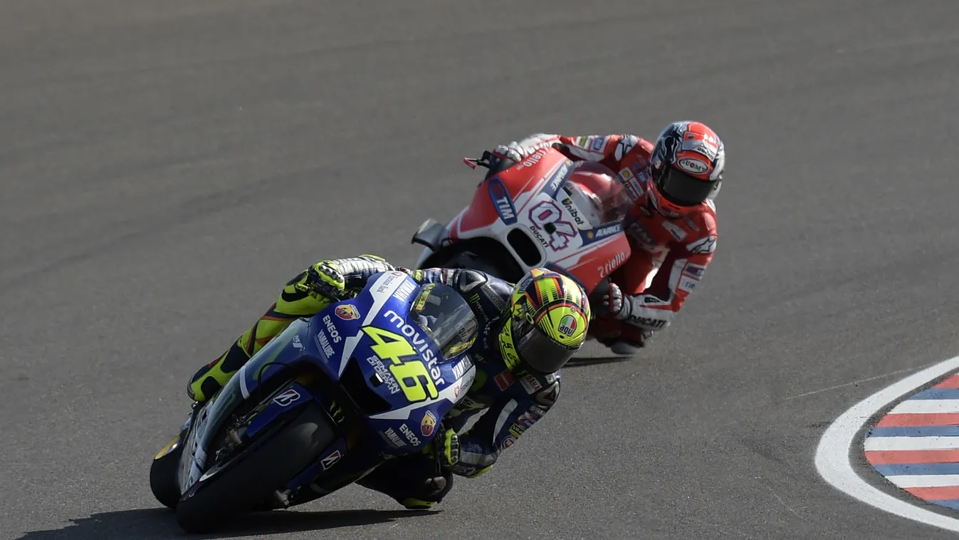 Italy's biker Valentino Rossi (46) on Yamaha and Italy's biker Andrea Dovizioso on Ducati, compete during the Argentina Grand Prix at Termas de Rio Hondo circuit, in Santiago del Estero, Argentina on April 19, 2015. Rossi survived a late battle with defen