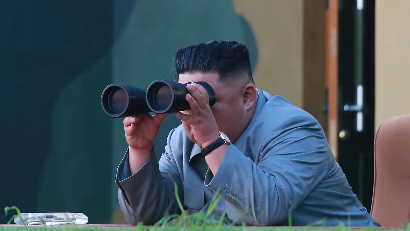 defence diplomacy armament Horizontal This picture taken on July 25, 2019 and released by North Korea's official Korean Central News Agency (KCNA) on July 26 shows North Korea's leader Kim Jong Un watching through binoculars as a new-type of tactical guid