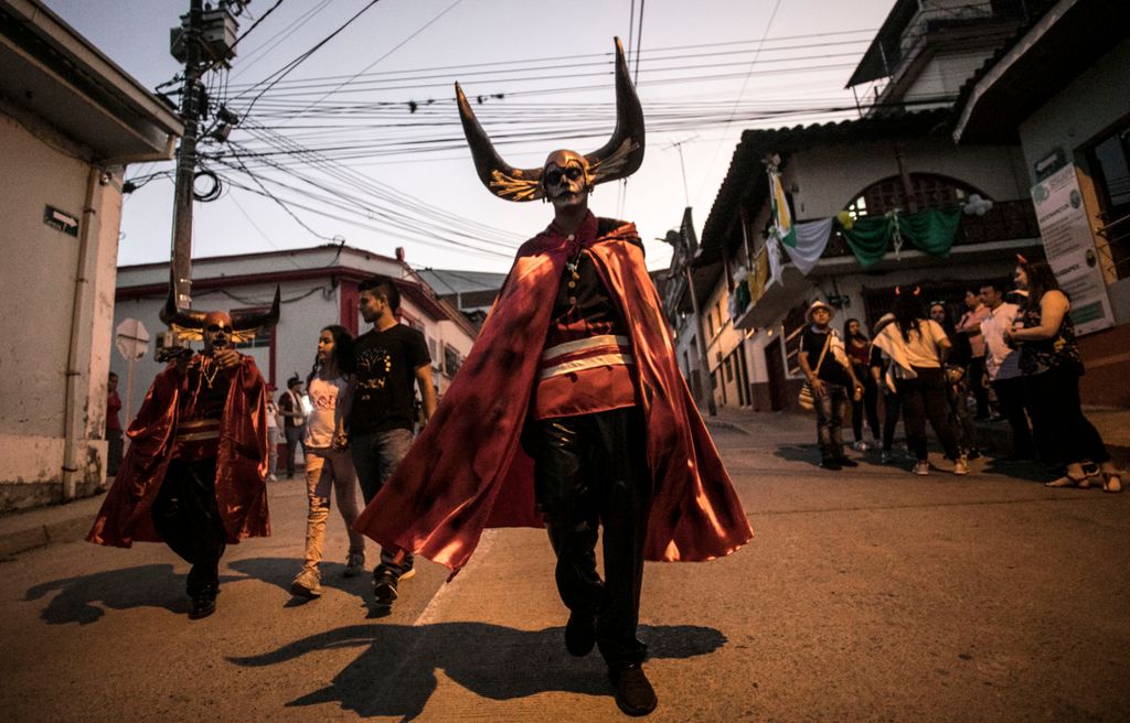 Revellers are pictured before the Devils parade at the Devil's Carnival, in Riosucio, Caldas department, Colombia, on January 5, 2019. - The Devil's Carnival -which runs from January 4 to 9 and takes place every two years- has its origins in the 19th cent
