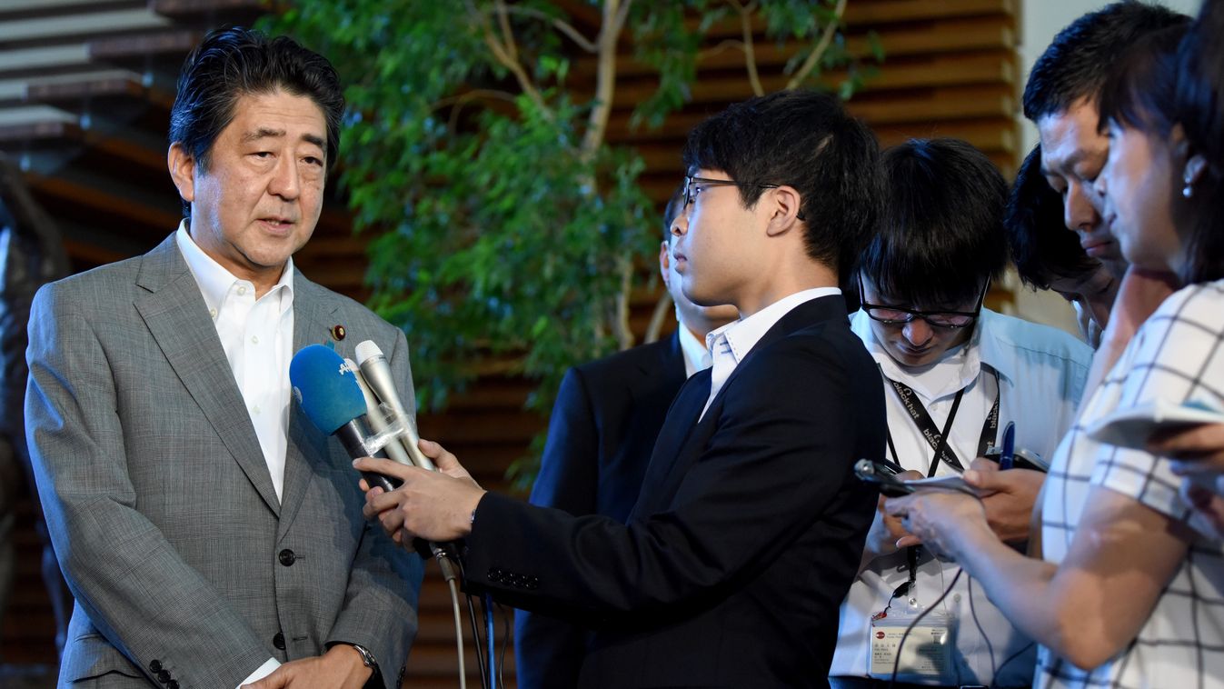 nuclear government Horizontal Japan's Prime Minister Shinzo Abe (L) speaks to journalists upon his arrival at his office in Tokyo on September 9, 2016 following news of North Korea's fifth nuclear test.
North Korea appears to have conducted a fifth nuclea