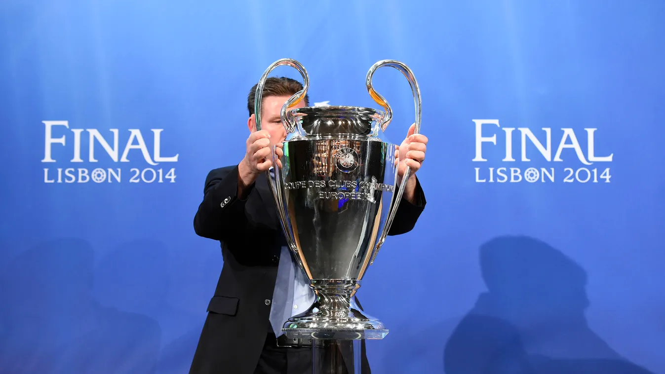 484336927 The Champions League trophy is put in place ahead of the draw for the semi-finals of the football UEFA Champions League at the UEFA headquarters in Nyon on April 11, 2014. AFP PHOTO / FABRICE COFFRINI 
