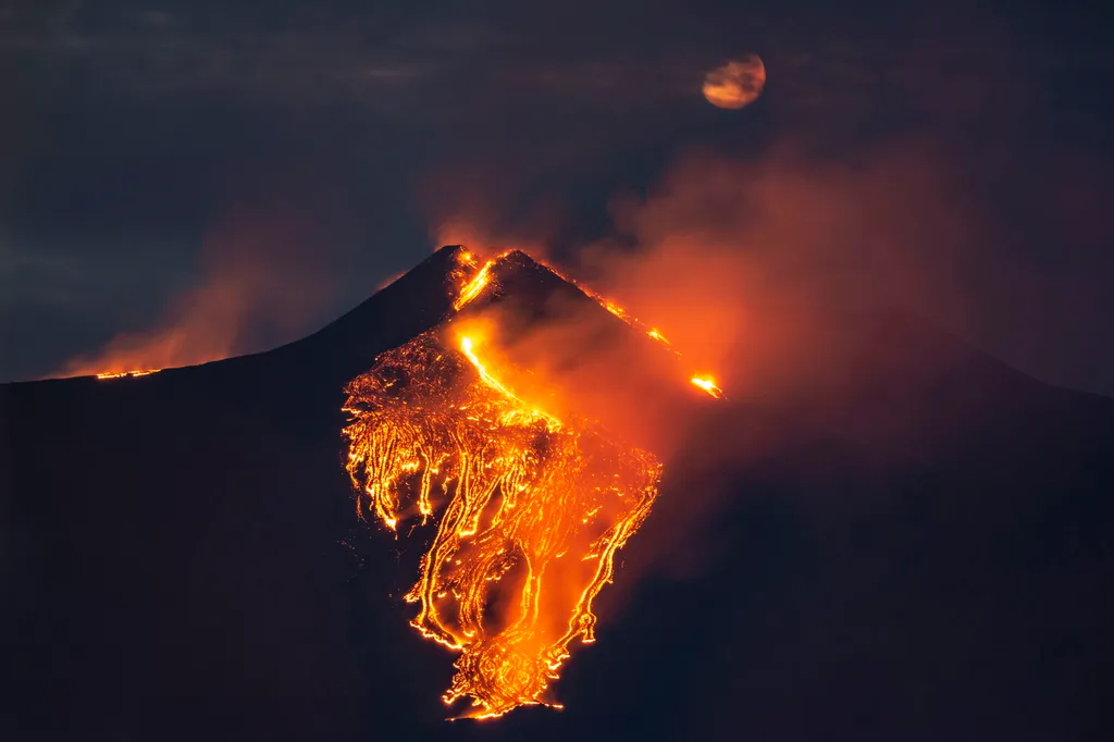 CATANIA, ITALY - FEBRUARY 23: Eruption at Mount Etna, in the early night there was a major increase in volcanic activity at the Southeast Crater, followed high lava fountains and lava flows along the flanks of the Southeast crater, photo taken from Giarre