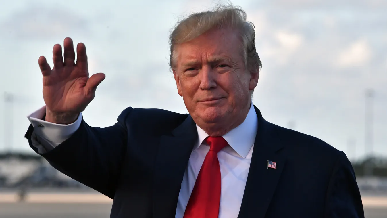 Horizontal POLITICS PERSON-POLITICS PRESIDENT HEADSHOT GESTURE GREETING WAVING US President Donald Trump waves upon arrival at Palm Beach International airport, Florida on April 18, 2019. (Photo by Nicholas Kamm / AFP) 