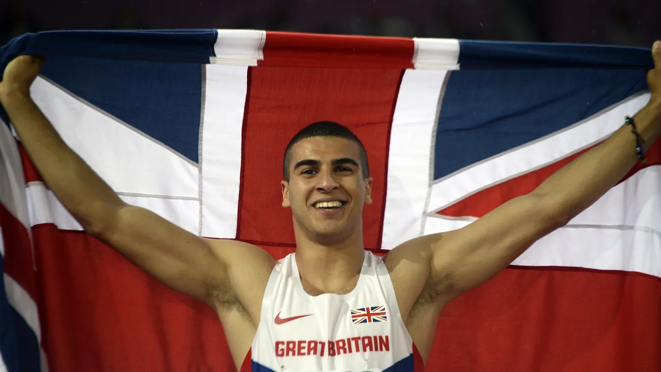 505612803 Great Britain's Adam Gemili, holding his national flag, celebrates after winning the Men's 200m final during the European Athletics Championships at the Letzigrund stadium in Zurich on August 15, 2014.   AFP PHOTO / FRANCK FIFE 