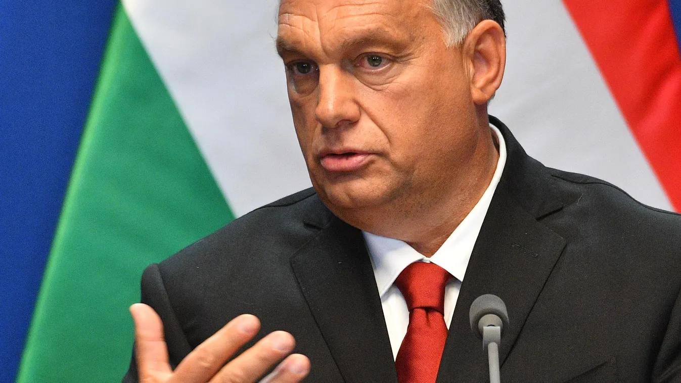 Horizontal Hungarian Prime Minister Viktor Orban addresses a press conference with his Finnish counterpart in the Carmelite monastery of the prime minister's office in Budapest on September 30, 2019. (Photo by Attila KISBENEDEK / AFP) 