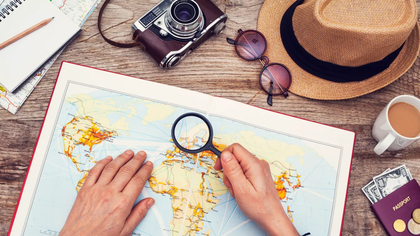 Planning vacation with map Travel Holiday Women Females Searching Passport Camera - Photographic Equipment Hat Planning Preparation Journey Exploration Travel Destinations Vacations Human Hand Tourist Passenger Summer Magnifying Glass Map Coffee - Drink S