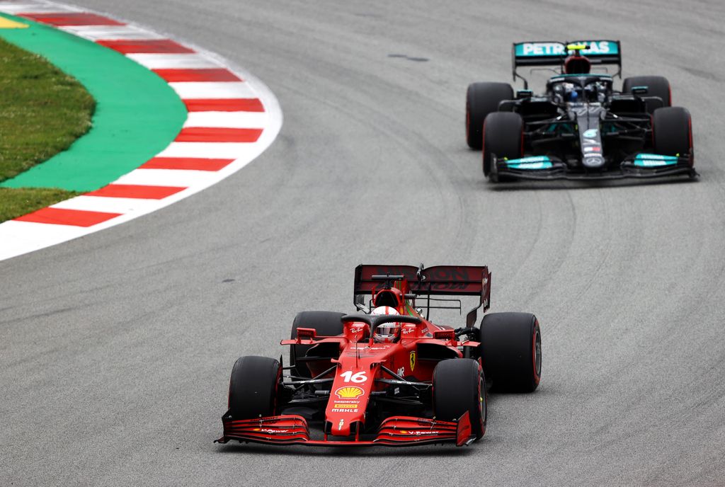 BARCELONA, SPAIN - MAY 09: Charles Leclerc of Monaco driving the (16) Scuderia Ferrari SF21 leads Valtteri Bottas of Finland driving the (77) Mercedes AMG Petronas F1 Team Mercedes W12 on track during the F1 Grand Prix of Spain at Circuit de Barcelona-Catalunya on May 09, 2021 in Barcelona, Spain. (Photo by Bryn Lennon/Getty Images) 
