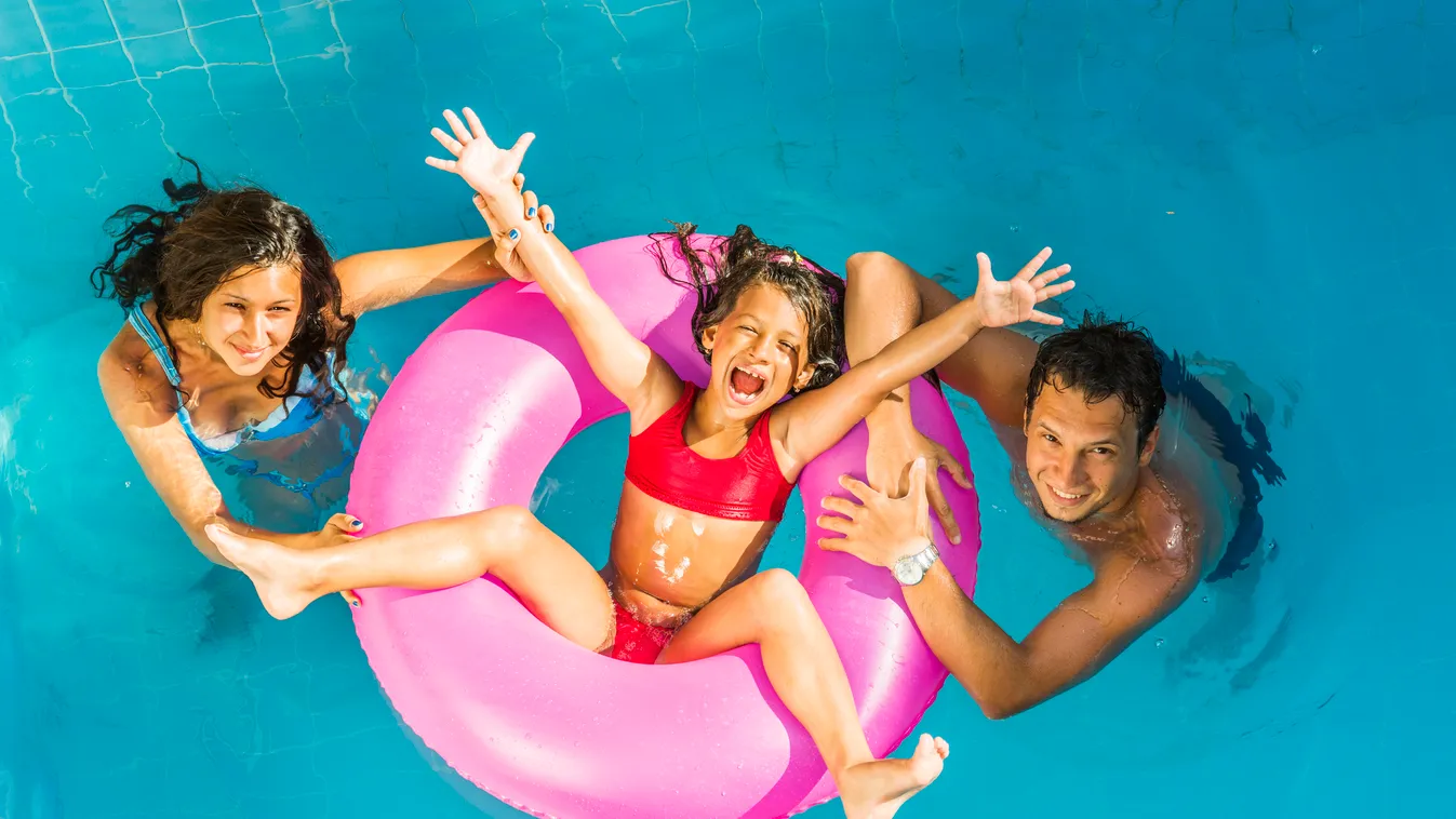 Family on vacation Posing Leisure Activity Girls Women Men Males Floating On Water Float Buoy Life Belt Inflating Inflatable Ring Inner Tube 20-29 Years Child Smiling Laughing Playing Playful Fun Togetherness Relaxation Joy Enjoyment Happiness Safety Trop