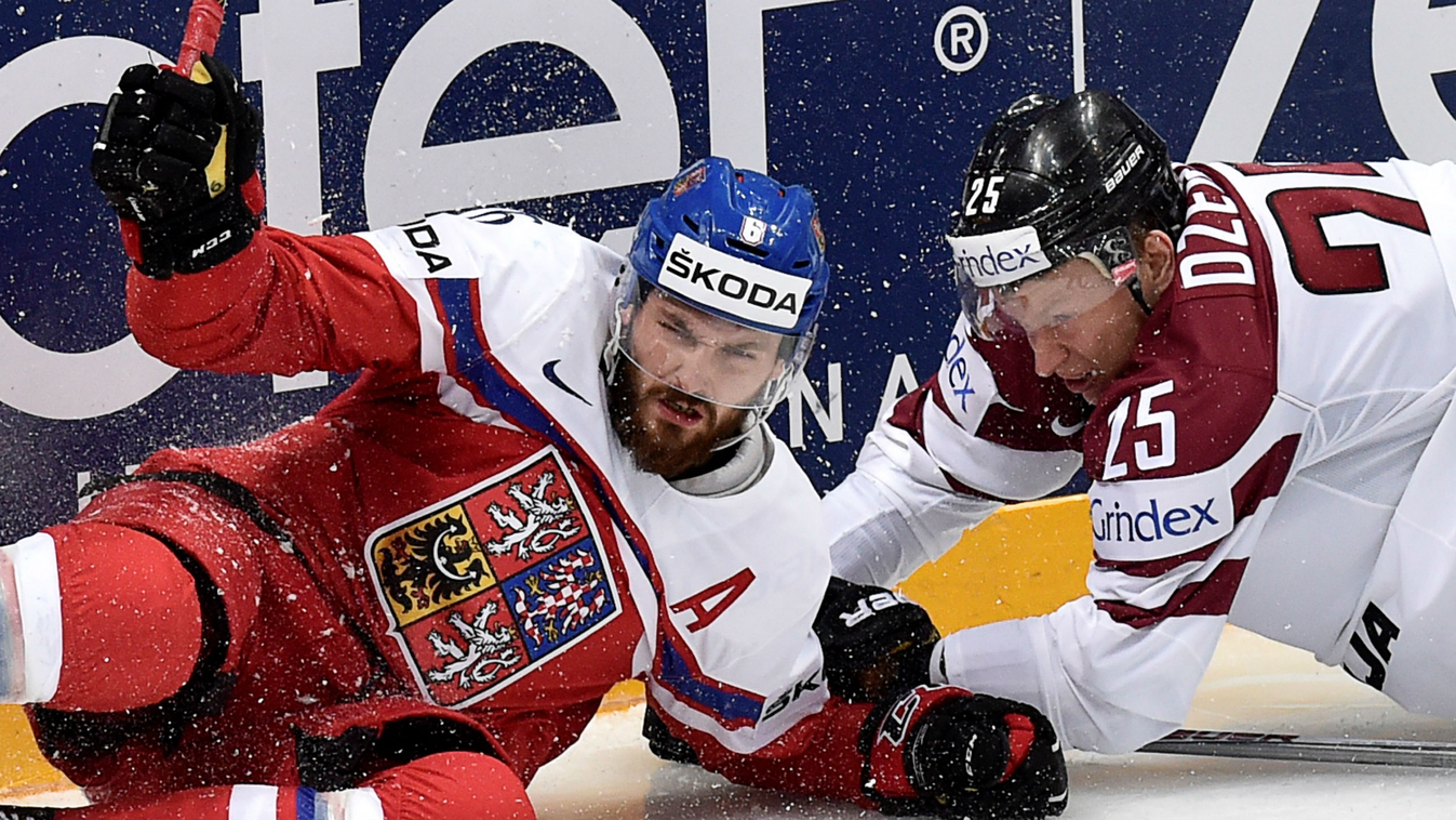 Latvia's forward Andris Dzerins (l) vies with Czech defender Michal Kempny during the group A preliminary round game Latvia vs Czech Republic at the 2016 IIHF Ice Hockey World Championship in Moscow on May 7, 2016. 